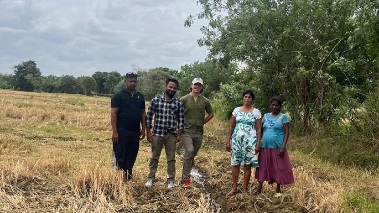 Alexis and Research Assistant Nadun meeting with local farmers.